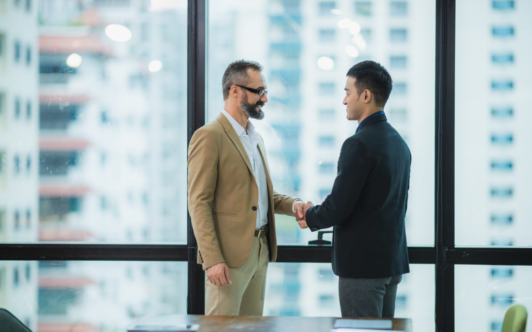 Two businessmen shake hands